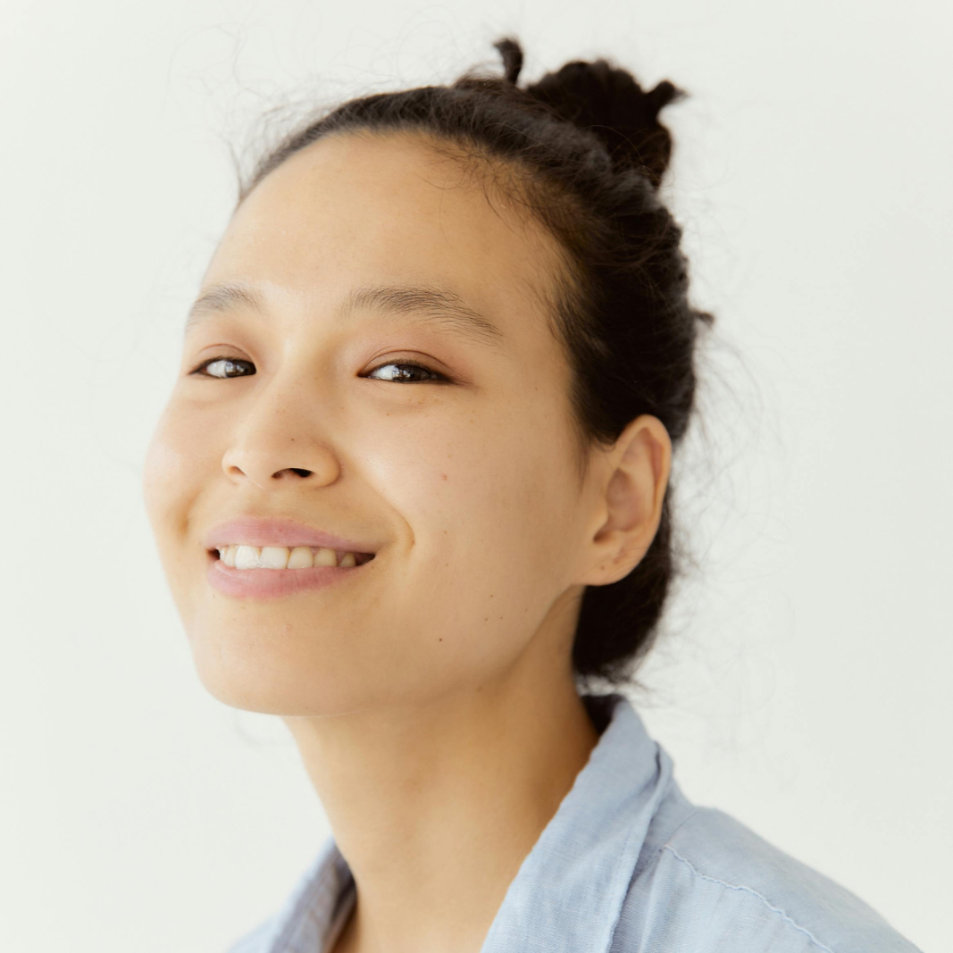woman smiling softly at camera