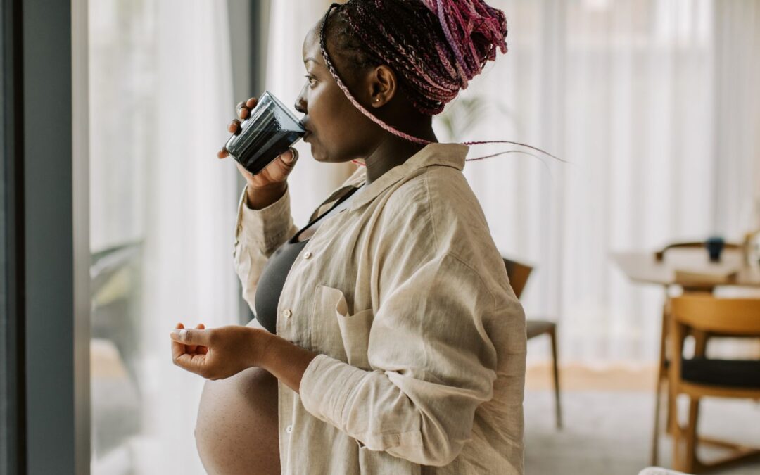 pregnant woman drinking water